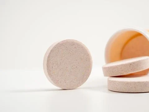 Effervescent multivitamin tablets on a white background. Stock Photos