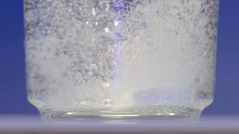 Effervescent Reaction: Tablet Fizzing Energetically in Water 스톡 동영상 322220361
