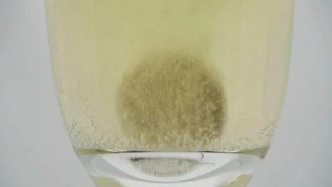 Effervescent tablet dissolves in a glass of water Stock Footage 102112051