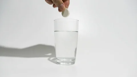 The effervescent tablet dissolves in water Stock Footage 119892758