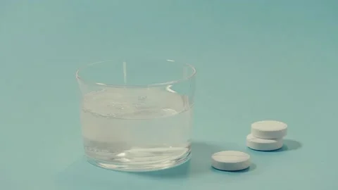  effervescent tablet dissolving in glass water. Stock Footage 142096878