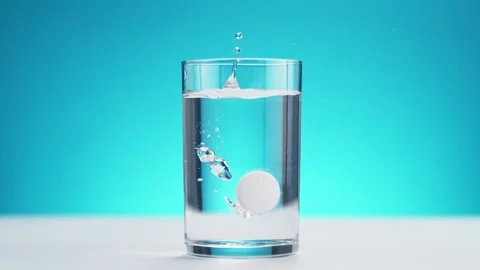 Effervescent Tablet Falling into Glass of Pure Water. Stock Footage 271006506