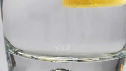 Effervescent tablet falling into glass of water Video stock 101060042