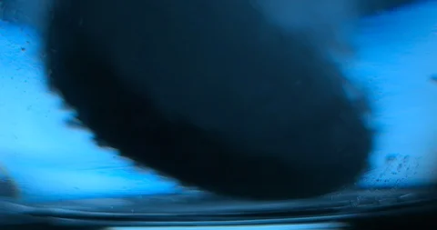 Effervescent tablet falling in water glass slowmotion 4K Stock Footage 93307547