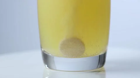 An effervescent tablet in a water glass Stock-Footage 153808258