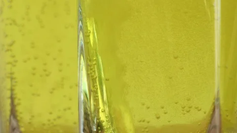 Effervescent vitamin C tablet bubbles in glass of water Stock Footage 88663507