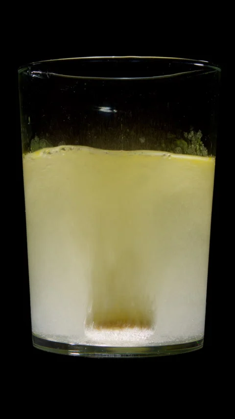 Effervescent Vitamin C Tablet Dissolving in Glass of Water Stock-Footage 341115878