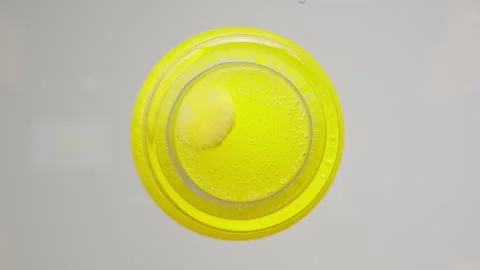 Effervescent vitamin tablet dissolving in water, bubbling with refreshing Video stock 292641004