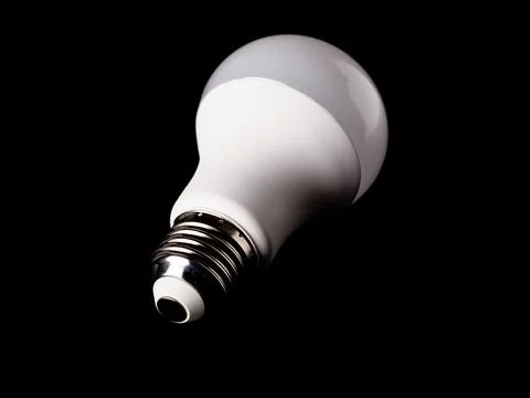 Efficiency energy saving LED light bulb isolated on a black Stock Photos