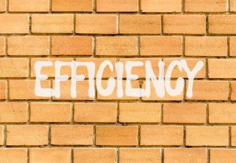 Efficiency symbol. Concept word Efficiency on beautiful big brown brick wal.. Stock Photos