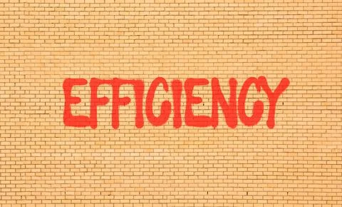Efficiency symbol. Concept word Efficiency on beautiful big brown brick wal.. Foto stock