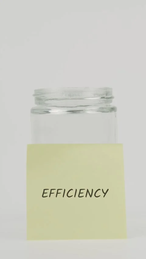 Efficiency text or word on yellow sticky note attached to glass jar Video stock 311724195