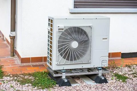 Efficient air source heat pump: modern solution for home heating and hot w... Stock Photos