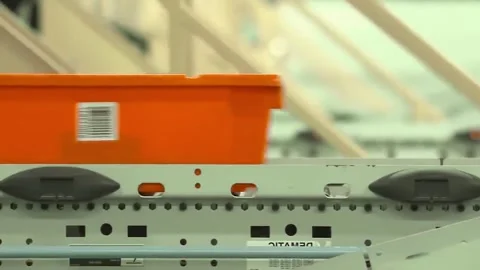 An Efficient Automated Sorting System designed with visually striking Orange Stock Footage 312172390