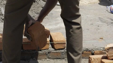 Efficient Brick Laying Technique - Expert Construction in Progress Stock Footage 314468923