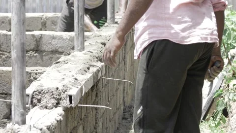 Efficient Bricklaying - A Master's Hand at Work Stock Footage 314470004
