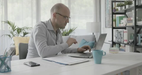 Efficient businessman working from home Stock Footage 162304013