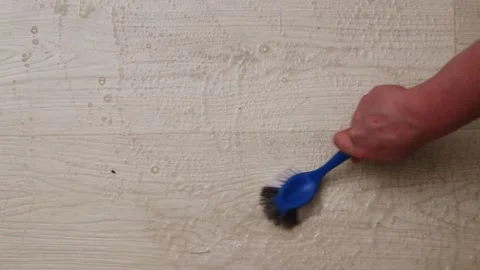 Efficient cleaning techniques using a brush on wooden surfaces Stock Footage 339070574
