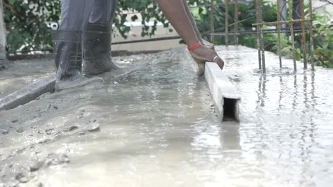 Efficient Construction - Expert Hand Guiding the Cement Stock Footage 324028018