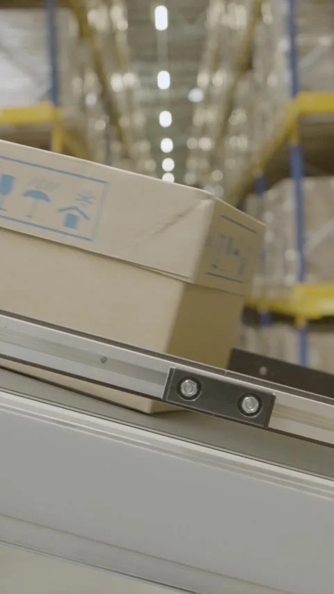Efficient Conveyor Belt System in Industrial Warehouse Setting Stock Footage 320152485