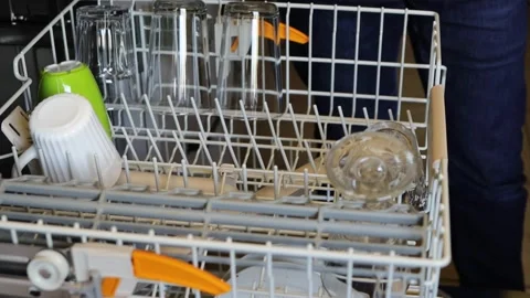 Efficient Dishwasher Loading. Close-up of a person placing  plates and glas.. Stock-Footage 280394735