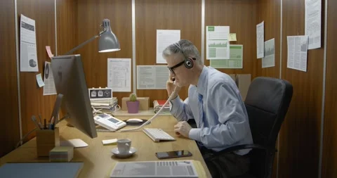 Efficient employee working in his small office Stock Footage 308922908