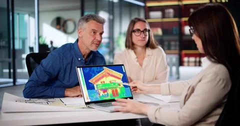Efficient Energy Auditor Assessing Thermal Performance Of Family House With T Stock Photos