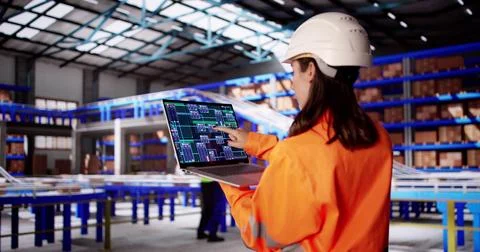 Efficient Female Engineer Inspects Warehouse Inventory, Ensuring Worker Safet Stock Photos