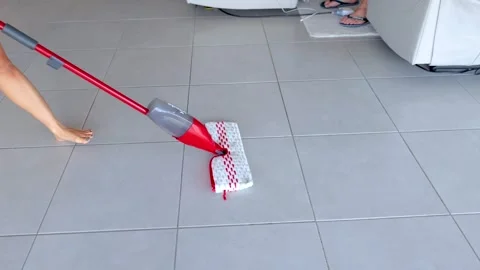 Efficient Floor Mopping in a Modern Living Room Stock Footage 308498316
