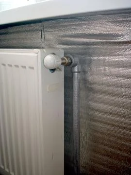 Efficient Heating Setup With Steel Radiator and Foil Insulation in Modern Spa Фото