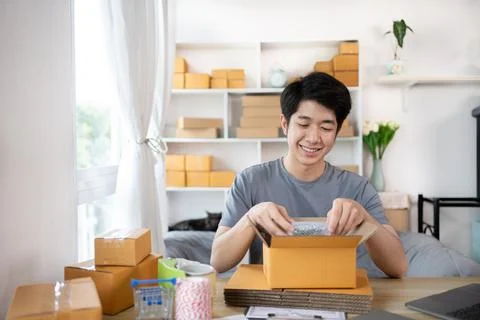 Efficient Home-Based Delivery, Man Packing Items into Post Box for Customer S Stock Photos