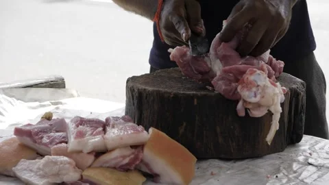 Efficient Meat Preparation  Expert Chops and Cuts Video stock 323997843