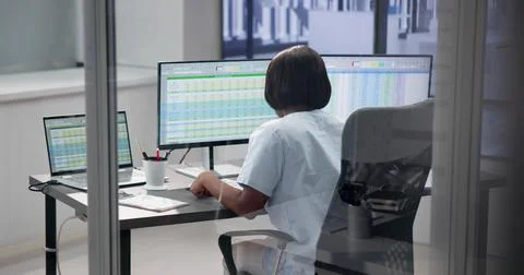 Efficient Medical Coder and Nurse Analyzing Data Stock Photos