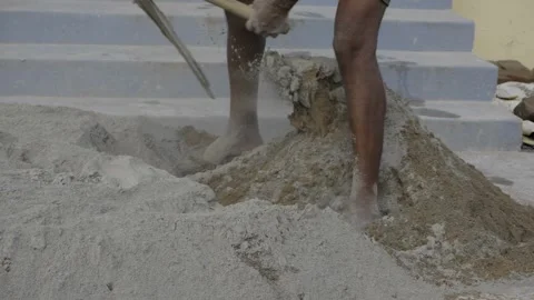 Efficient Mixing Techniques - Expertly Crafting Cement in Construction Stock Footage 324032954