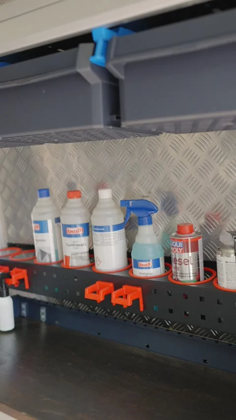 Efficient mobile workshop setup with various fluids and sprays in van Stock Footage 336421043