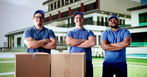 Efficient movers load van with boxes Stock Photos
