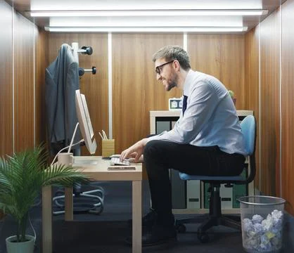 Efficient office worker in a tiny room Stock Photos
