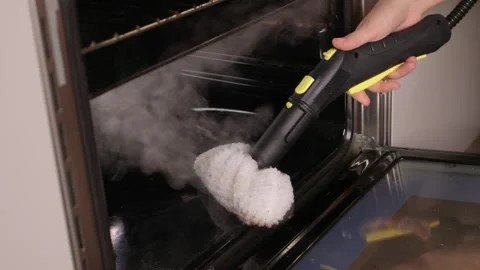 Efficient Oven Cleaning Made Simple with Advanced Steam Technology for Your Stock Footage 319895994