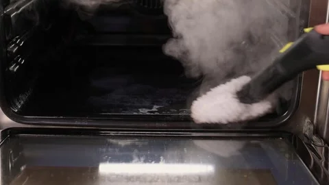 Efficient Oven Cleaning Made Simple with Advanced Steam Technology for Your Stock Footage 319896034
