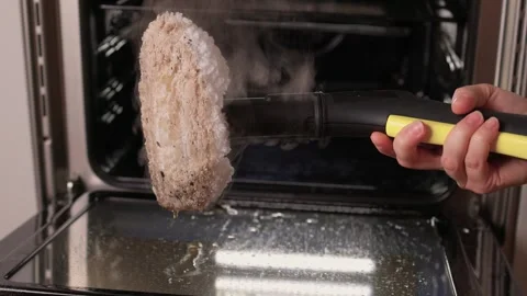 Efficient Oven Cleaning Made Simple with Advanced Steam Technology for Your Stock Footage 319896101