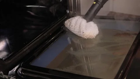Efficient Oven Cleaning Made Simple with Advanced Steam Technology for Your Stock Footage 319896222