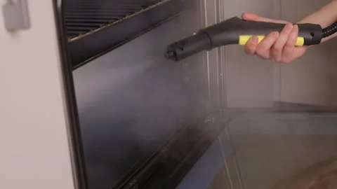 Efficient Oven Cleaning Made Simple with Advanced Steam Technology for Your Stock Footage 319896227