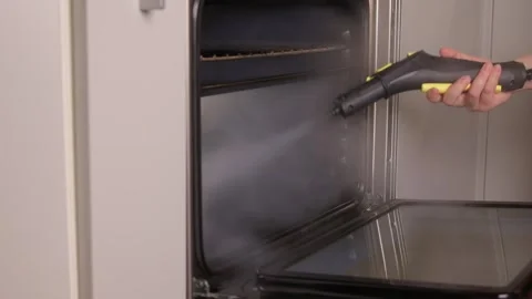 Efficient Oven Cleaning Made Simple with Advanced Steam Technology for Your Stock Footage 319896279