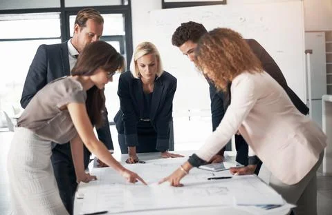 Efficient planning is a team effort. a team of professionals working on Stock Photos