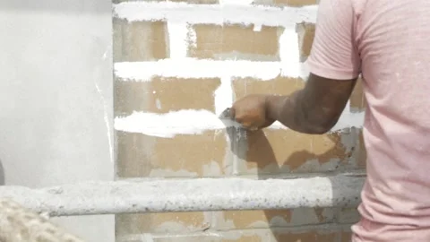 Efficient Plastering Technique - Expert Hands at Work Stock Footage 314484761