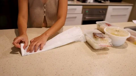 Efficient Plastic Bag Folding in a Kitchen Setting 動画素材 306903799