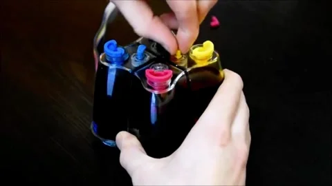 Efficient Printer Ink Refill Using a Continuous Supply Cartridge Stock Footage 321337619