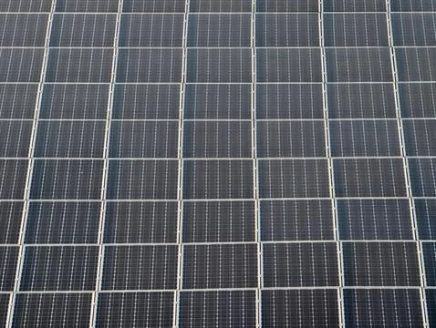 Efficient renewable energy sources showcased through patterned solar panels.. Stock Photos