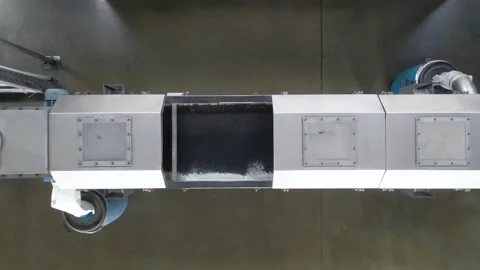 Efficient rubber conveyor system transporting materials in a factory environment Stock Footage 306300122