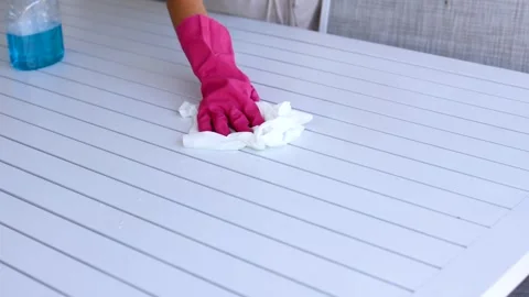 Efficient Table Cleaning with Spray and Wipe Stock Footage 312186407